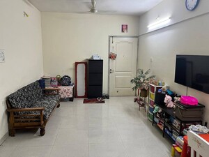 Living Room in 2 BHK Apartment at Magarpatta City Roystonea, Hadapsar – for Sale