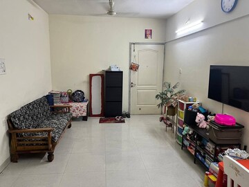 Living Room in 2 BHK Apartment at Magarpatta City Roystonea, Hadapsar – for Sale