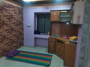 Living Room in 1 BHK Apartment at Shri Datta Nandnavan Building, Dhankawadi – for Rent