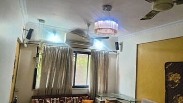 Living Room in 1.5 BHK Apartment at Sun N Dew Apartment, Santacruz East – for Rent