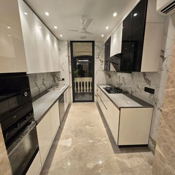 Kitchen in 4 BHK Builder Floor at Wave City Center, Sector 32 – for Sale