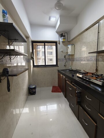 Kitchen in 1 BHK Apartment at K Raheja Palm Spring, Malad West – for Rent