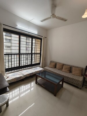 Living Room in 1 BHK Apartment at K Raheja Palm Spring, Malad West – for Rent