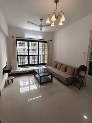 Living Room in 1 BHK Apartment at K Raheja Palm Spring, Malad West – for Rent