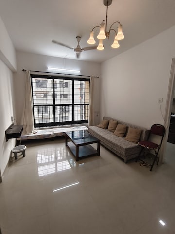 Living Room in 1 BHK Apartment at K Raheja Palm Spring, Malad West – for Rent