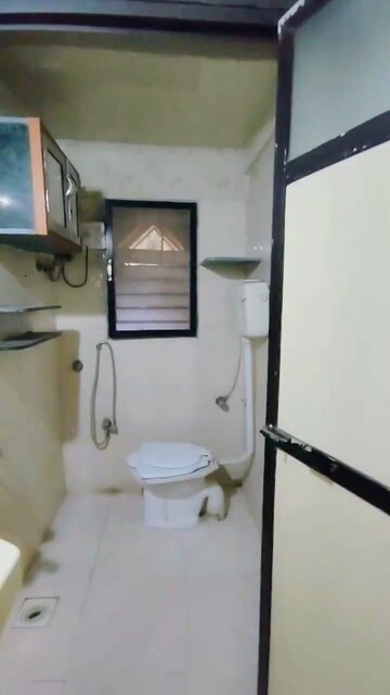 Staircase in 2 BHK Apartment at Lokhandwala Vinay Tower, Kandivali East – for Sale