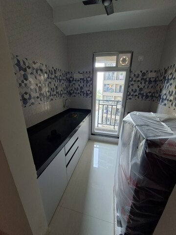 Kitchen in 1 BHK Apartment at Raunak Delight, Owale – for Rent