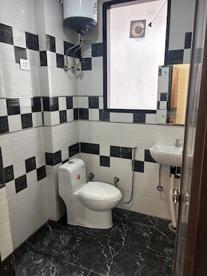 Bathroom in 2 BHK Builder Floor at RWA Parmanand, Mukherjee Nagar – for Sale