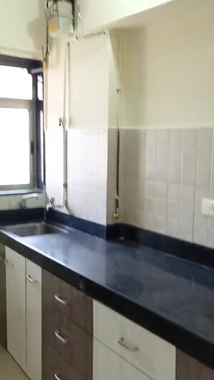 Kitchen in 1 BHK Apartment at Gala Lifestyle Pride Residency, Kasarvadavali – for Sale