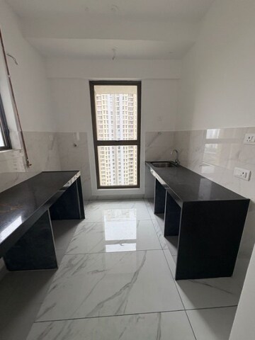 Kitchen in 1 BHK Apartment at Raymond Ten X Habitat, Pokhran Road No Two – for Rent
