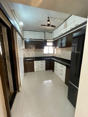 Kitchen in 3 BHK Apartment at Cosmos Jewels, Ghodbunder Road – for Rent
