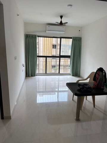 Living Room in 2 BHK Apartment at Lodha Quality Home Tower 5, Majiwada – for Rent