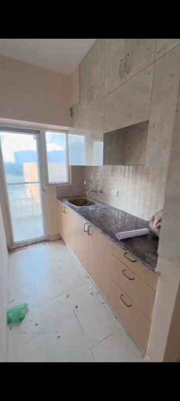 Kitchen in 1 BHK Apartment at Amrapali Dream Valley, Tech Zone 4 Greater Noida – for Rent