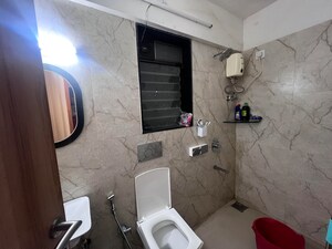 Bathroom in 2 BHK Apartment at Pratham ARC Aura, Andheri West – for Rent