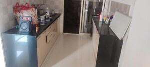 Kitchen in 2 BHK Apartment at Shivam 19 Grand West, Thergaon – for Rent