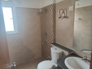 Bathroom in 3.5 BHK Apartment at ATS Homekraft Pious Hideaways, Sector 150 – for Rent