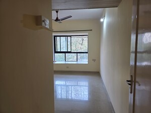 Room in 2 BHK Apartment at Lokhandwala Whispering Palms, Kandivali East – for Sale