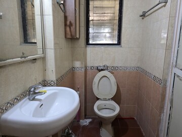Bathroom in 2 BHK Apartment at Lokhandwala Whispering Palms, Kandivali East – for Sale
