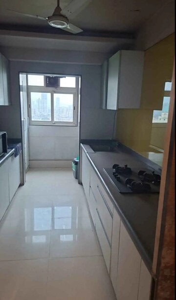 Kitchen in 3 BHK Apartment at Hiranandani Estate Rodas Enclave, Ghodbunder Road – for Rent
