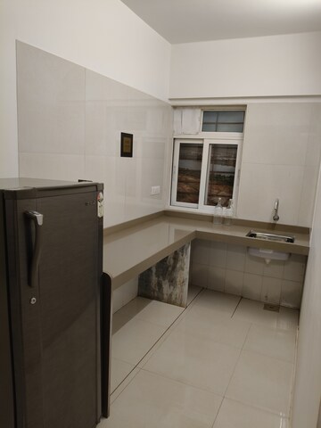 Kitchen in 1 BHK Apartment at Dosti West County, Balkum Pada – for Sale