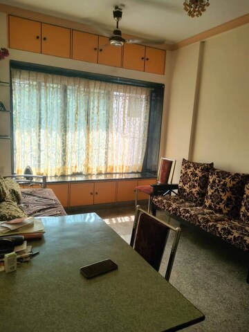 Living Room in 2 BHK Apartment at Vrindavan ABC CHS, Malad East – for Rent