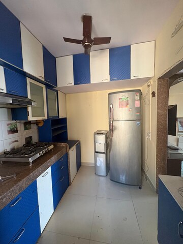 Kitchen in 2 BHK Apartment at Kanakia Spaces Niharika, Manpada – for Rent