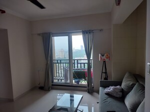 Living Room in 1 BHK Apartment at Raunak Bliss, Ghodbunder Road – for Rent