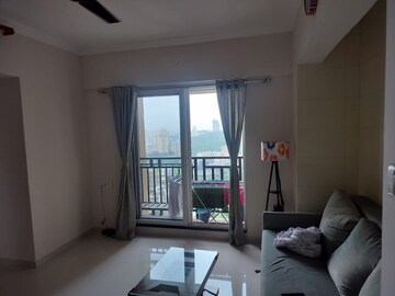 Living Room in 1 BHK Apartment at Raunak Bliss, Ghodbunder Road – for Rent