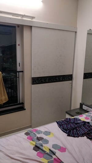 Living Room in 2 BHK Apartment at Rustomjee Azziano Wing D, Thane West – for Sale