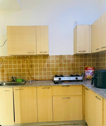 Kitchen in 2 BHK Apartment at Mahagun Mywoods, Sector 16c Greater Noida – for Rent