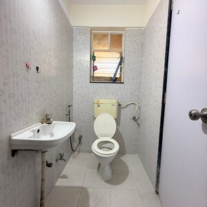 Bathroom in 2 BHK Apartment at Vyas Whispering Wind Phase II, Link Road – for Rent