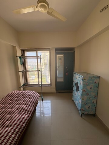 Bedroom in 2 BHK Apartment at Kanakia Spaces Niharika, Manpada – for Rent