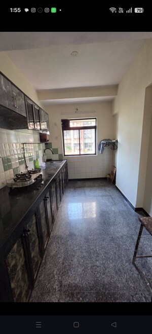 Kitchen in 2 BHK Apartment at Chincholi Apartment, Malad West – for Rent