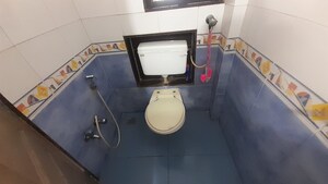 Bathroom in 2 BHK Apartment at Nav Sanyukt CHS, Andheri East – for Rent