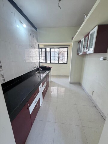 Kitchen in 2 BHK Apartment at Magarpatta City Roystonea, Hadapsar – for Sale