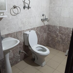 Bathroom in 2 BHK Apartment at Aims Golf City, Sector 75 – for Rent