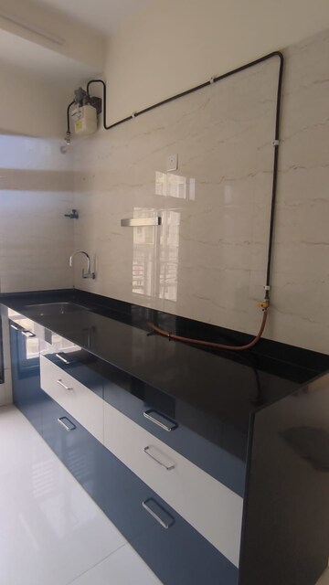 Kitchen in 1 BHK Apartment at Romell Rhythm, Malad West – for Sale