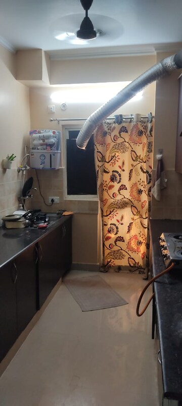 Living Room in 2.5 BHK Apartment at Aims Golf City, Sector 75 – for Rent