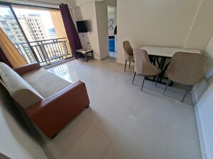 Living Room in 1 BHK Apartment at Raunak Bliss, Ghodbunder Road – for Rent