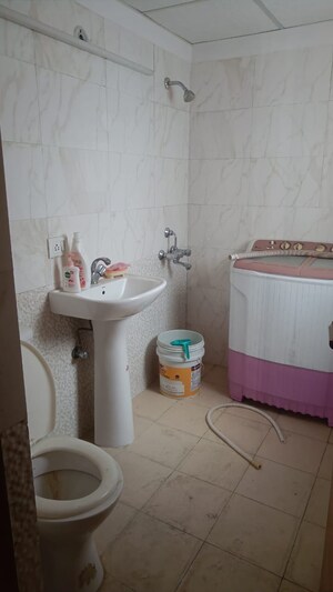 Bathroom in 3.5 BHK Apartment at Aims Golf City, Sector 75 – for Sale