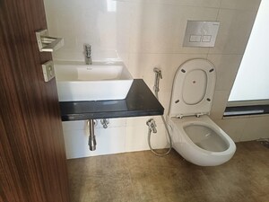 Bathroom in 1 BHK Apartment at Omkar Signet, Malad East – for Rent