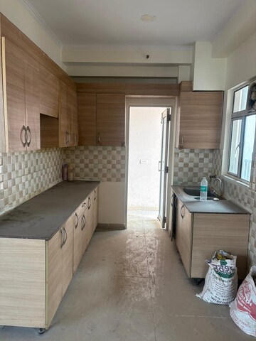 Kitchen in 2 BHK Apartment at Omkar Royal Nest, Tech Zone 4 Greater Noida – for Sale