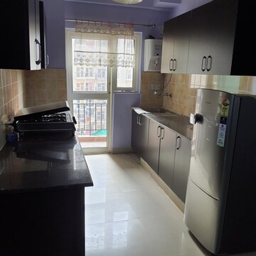 Kitchen in 2.5 BHK Apartment at Aims Golf City, Sector 75 – for Sale