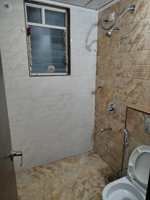 Bathroom in 3 BHK Apartment at Rainbow Athashri At Pebbles, Bavdhan – for Rent
