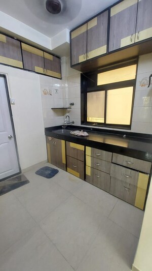 Kitchen in 3 BHK Apartment at Om Sai Charan CHS, Borivali West – for Sale