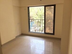 Room in 2 BHK Apartment at Shiv Prasad CHS Dahanukar Wadi, Kandivali West – for Sale