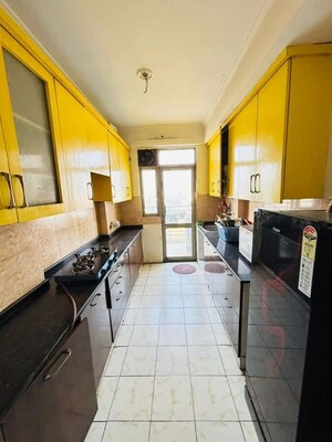 Kitchen in 2 BHK Apartment at Ajnara Homes, Sector 16b Greater Noida – for Rent