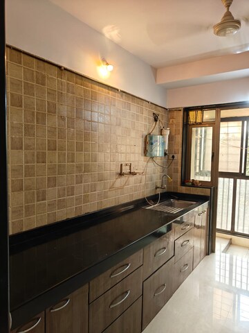 Kitchen in 2 BHK Apartment at Blue Mountains, Malad East – for Rent