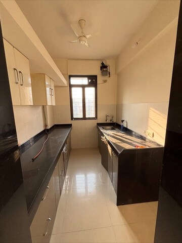 Kitchen in 2 BHK Apartment at Lodha Paradise, Majiwada – for Rent