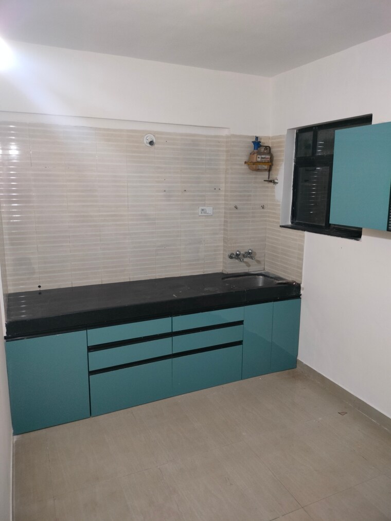 Kitchen, gurukrupa-astter 2 Bedroom 700 Sq.Ft. Apartment In Wadgaon Sheri Pune 9559531